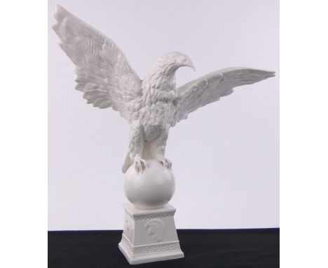 A large white glaze ceramic Golden Eagle on plinth,height 26".