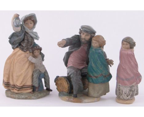 A Lladro matt glazed porcelain figure Lady with a lamp,height 14.5", a NAO figure fisherman and child height 12.5" and a NAO 
