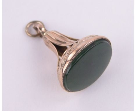 A 9ct gold jade set fob seal.