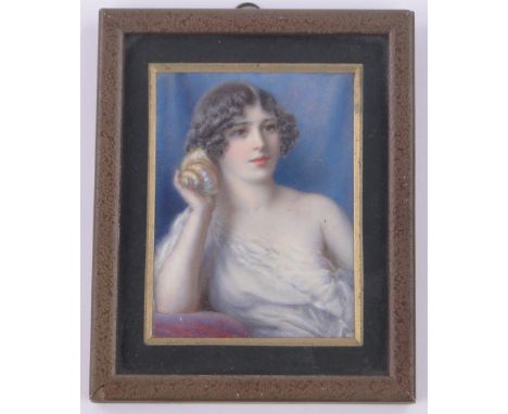 A miniature watercolour on ivory,portrait of a girl holding a shell to her ear, by Ephraim Strellett, signed with artist's in