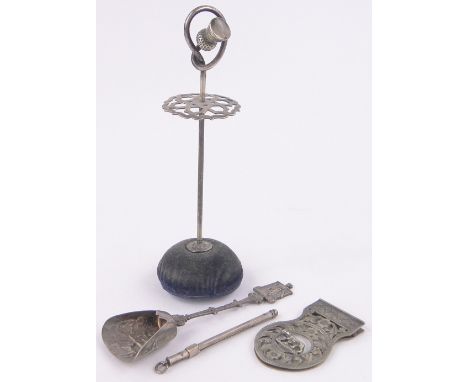 Group of silver items,including a thistle design hatpin stand, caddy spoon, etc.