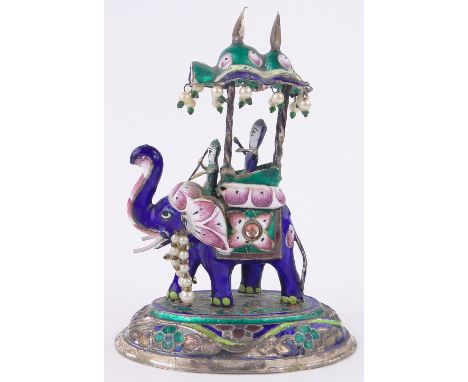 An Indian silver and coloured enamel caparisoned elephant,height 4.5".
