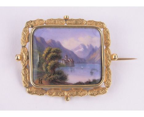 A 19th century Swiss unmarked gold and painted enamel brooch,depicting view towards Chateau Chillon, width 30mm.