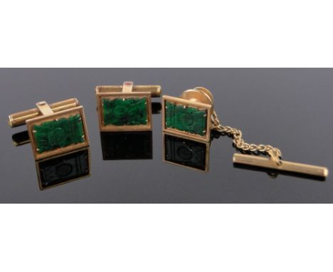 A pair of Chinese 14ct gold cufflinks with carved jade mounts,and a matching 14ct gold dress stud, gross weight 12.5g.