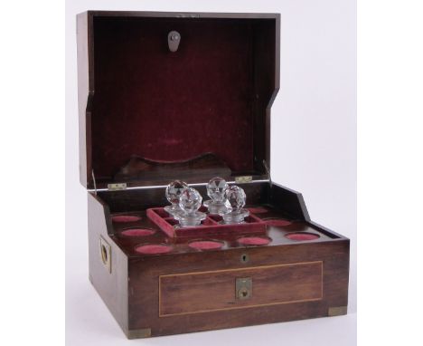 A brass bound mahogany decanter box,with 4 cut-glass decanters and drawer under, width 16", height 11".