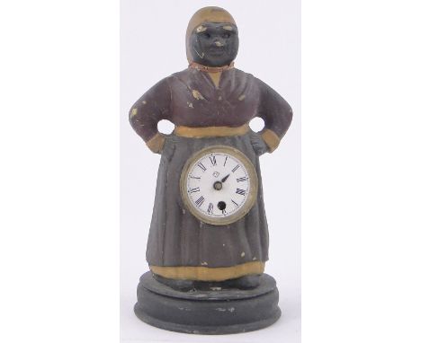 An American cast-iron housemaid design mantel clock by Ansonia,with moving eyes, height 11".