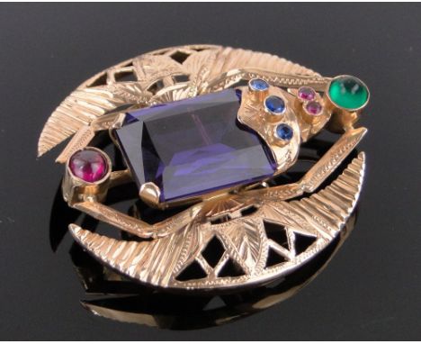 A Middle Eastern high carat gold scarab design brooch,set with a large synthetic sapphire, cabochon ruby and emerald in pierc