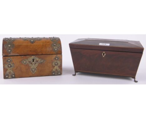 A 19th century mahogany sarcophagus shaped tea caddy,on brass feet, length 10.5" and a Victorian walnut and brass mounted dom