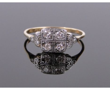 An 18ct gold and platinum diamond set panel ring,setting height 7mm, size O.