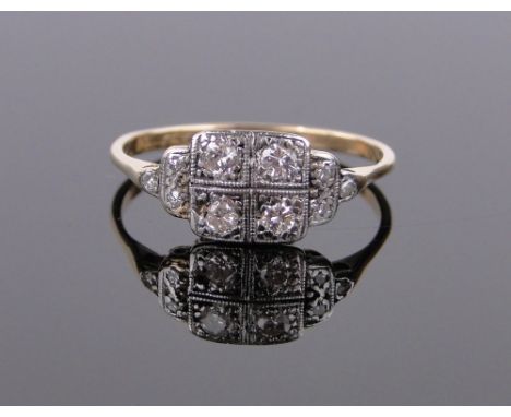 An 18ct gold and platinum diamond set panel ring,setting height 7mm, size O.