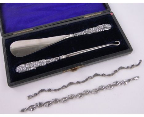 A silver handled button hook and shoe horn,and 2 stone set silver bracelets.