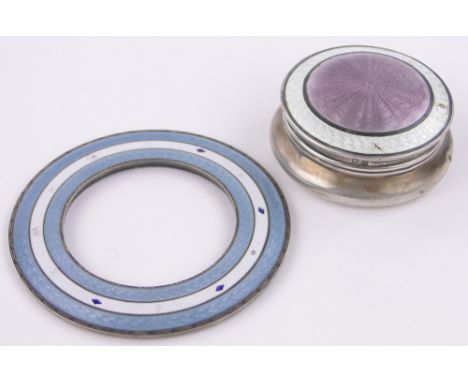 A Cartier silver and blue enamel desk clock front,diameter 77mm and a silver and pink enamel top pillbox, diameter 55mm, (2).