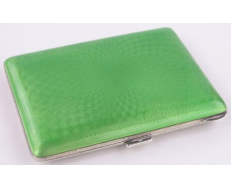 A silver and green enamel cigarette case,import marks London 1930, height 8.5cm.