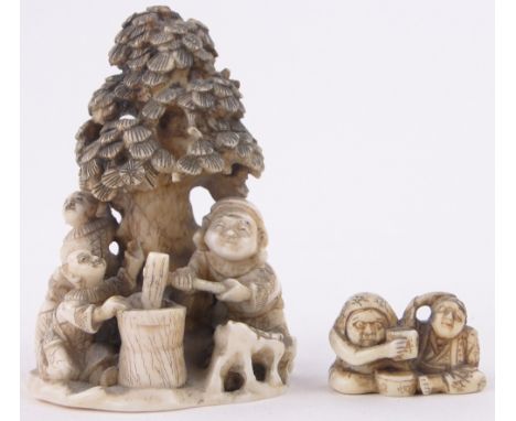 A 19th century Chinese carved ivory Okimono depicting figures and children under a tree,signed under base, height 3" together