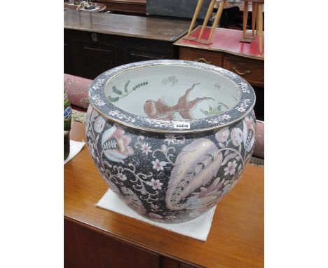 A Large Chinese Style Planter, decorated with fish to the inside and brids to the outside, 35cm high.