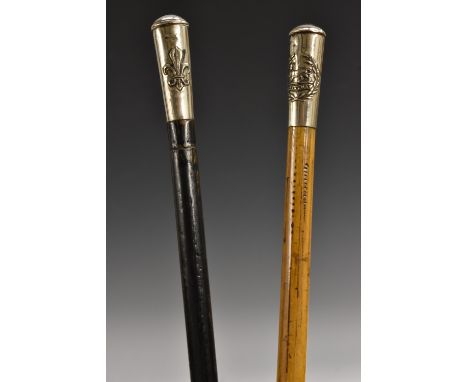 A World War I silver coloured metal mounted swagger stick, Uppingham, bamboo shaft, 71cm long; another (2)