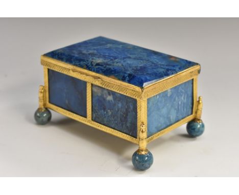 A 19th century 'lapis lazuli' agate rectangular casket, hinged cover, engine turned gilt metal mounts, ball feet, 8.5cm wide,