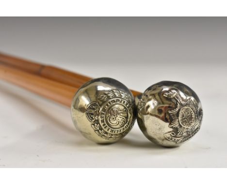 A World War I silver coloured metal mounted swagger stick, The Royal Sussex Regiment, globular pommel, bamboo shaft, 70cm lon