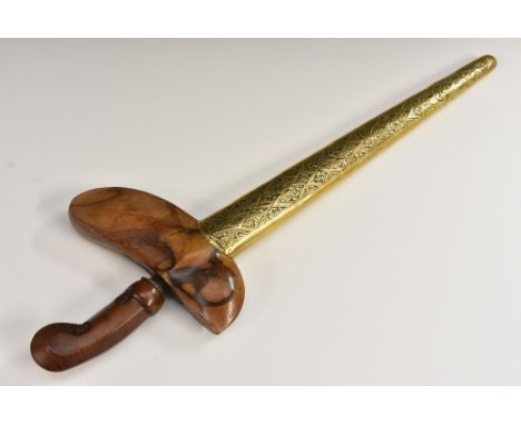 An Indonesian kris, 33.5cm shaped and pierced blade, hardwood hilt carved with stylised lotus, chased brass mounted scabbard,