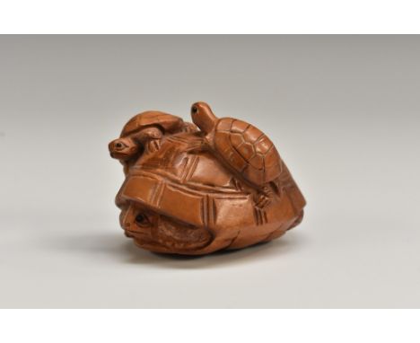A Japanese boxwood netsuke, carved as a turtle and young, 5cm long, signed Condition Report: condition generally good, see ad