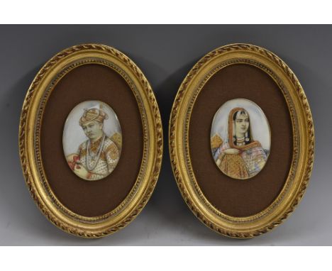 Indian School (19th century), a pair of portrait miniatures, of a man and his wife, half-length and turned to one another, po