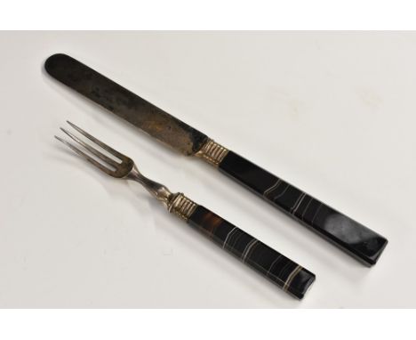 An early 19th century specimen banded agate and silver-coloured metal knife and fork, canted tapering lapidary hafts, turned 