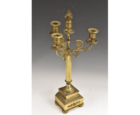 A 19th century gilt brass three-light candelabrum, in the Empire taste, campana sconces, reeded column, acanthus-grasped scro