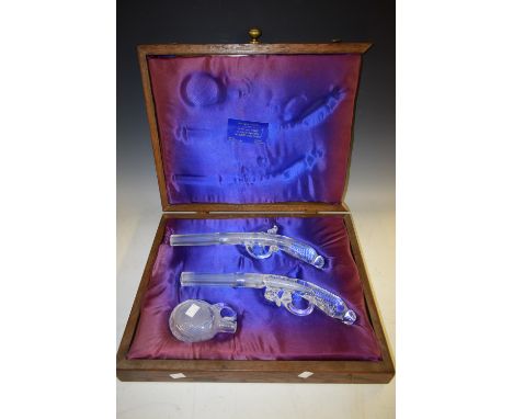 A pair of Tutbury Georgian Crystal model flintlock pistols, with powder flask ensuite, 35cm long, cased (faults)