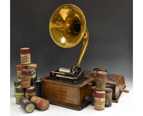 An Edison Standard Phonograph, serial number 633009, in oak case, A J Howson brass horn;  thirty four wax cylinders Condition