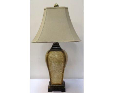 LARGE TABLE LAMP
with crackle glaze effect shaped body, raised on a shaped square base, 81cm high, with shade