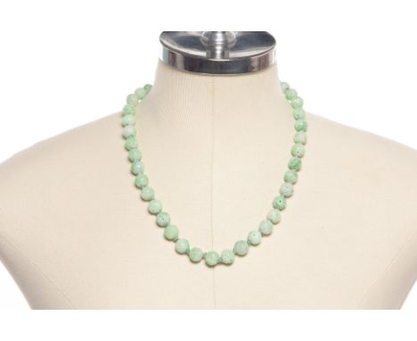 A JADE BEAD NECKLACE AND OTHER ITEMS
Includes a carved jade beaded necklace, a jade pendant on a rope necklace, and two carve
