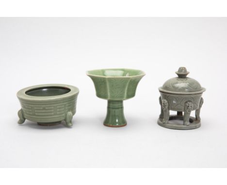 THREE CELADON GLAZED VESSELS
Comprising: an octagonal stem cup; an eight trigrams tripod censer; and a censer and cover, with