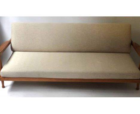 SOFA/DAYBED BY GUY ROGERS, 1970's teak with soft grey cotton union upholstery (opening to form storage compartment), 184cm W.