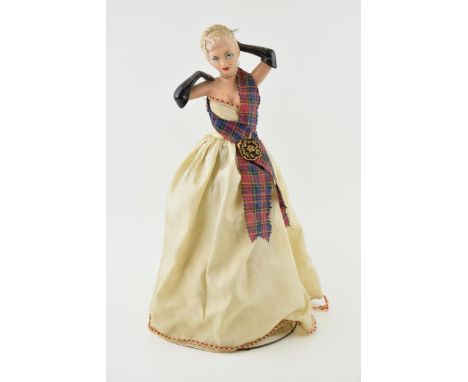 A lamp in the form of a lady in gown. Celluloid construction with wire frame. c1950s. Height 39cm.  Generally good with origi