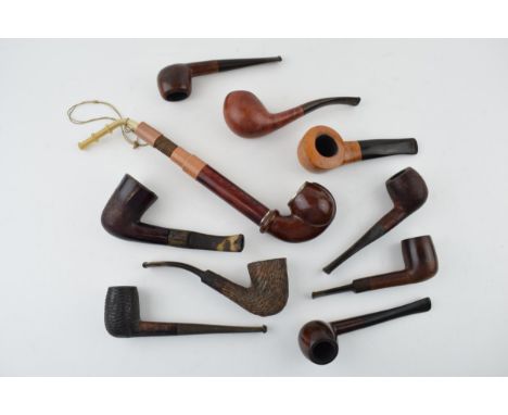 A collection of vintage tobacco smoking pipes to include briar examples by 'I R Navy, 'Clifton' and other similar examples. (