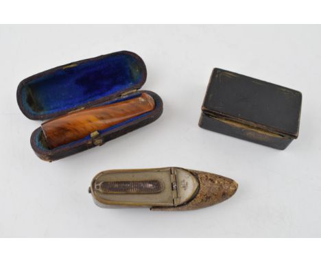 A collection of items to include an cased amber cigar holder, paper mâché snuff box and a vesta case in the form of a shoe. (