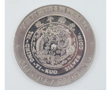 A Tai-Ching-Ti-Kuo Silver Coin. Diameter 50mm. Height 29.3 grams.  With some signs of light wear.