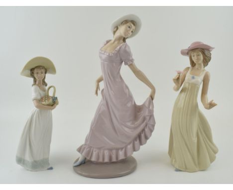 Nao figures to include a girl in a purple dress a girl with a basket of flowers and a girl holding a flower (3), largest 30.5