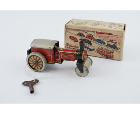 Boxed Brimtoy 'British Made' 9/501 clockwork 'Steamer' tin toy in working order with key.  Height 5cm.  In original boxed con