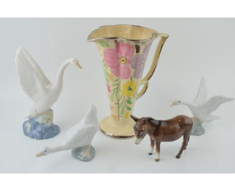 An Arthur Wood floral Art Deco vase with a Beswick donkey (af), with 2 Nao geese and a Lladro Goose (5).  