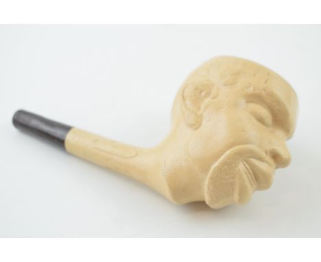 A clay pipe in the form of a man's head. Length 14cm.  In good original condition. Free of damage or restoration. Does not ap