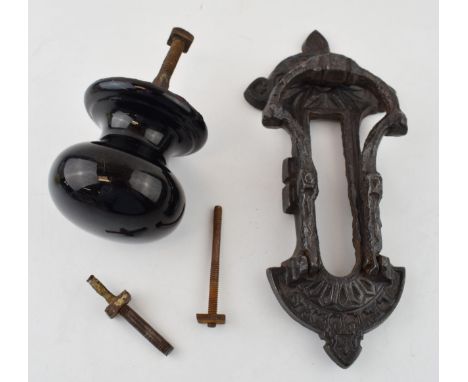 A Kenrick and Sons or similar door knocker together with a ceramic Victorian door knob. (2) 23cm.  Some wear to casting comme