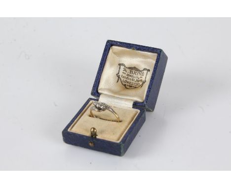 18 carat gold ring with three platinum set diamonds, ring size O, 2.3g