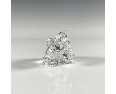 The famously gloomy character from Winnie the Pooh. This Swarovski figurine depicts Eeyore seated, featuring a faceted clear 