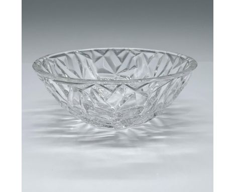 Stunning hand-cut crystal bowl, meticulously polished to perfection, boasting intricate geometric cuts that catch and reflect