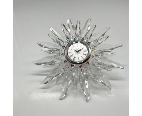 Part of the Exquisite Accents series. Clear crystal clock is intricately detailed featuring a rainbow of colorful crystals fr