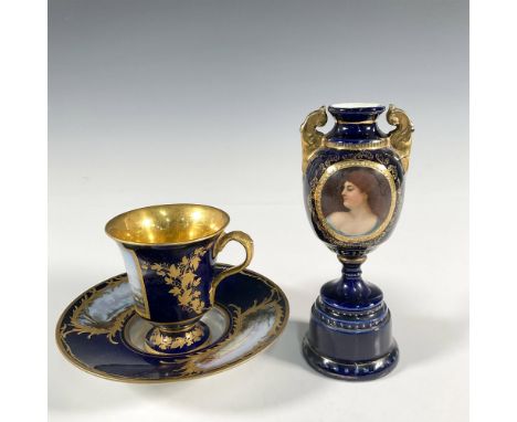 A collection of three European porcelain comprising of A Royal Vienna cobalt blue vase of urn shape with an oval panel with h