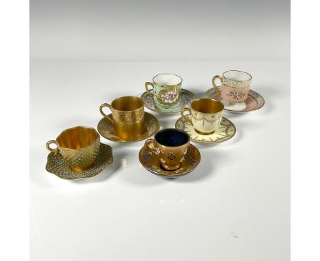 Unique collection of exquisitely hand painted dainty demitasse cup and saucer sets including raised enamel and gilded details