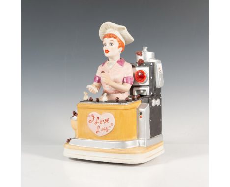 A porcelain painted figure inspired by the 1950s American sitcom, I Love Lucy, depicts a memorable episode, Job Switching, of