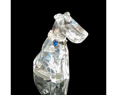 Large terrier with clear faceted body wearing metal collar with blue crystal stone. Part of the Symbols collection. Swarovski